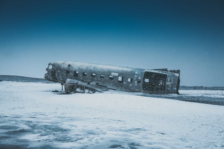 Old Rough Plane Cabin After Disaster On Snowy Terrain