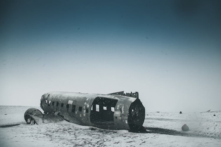 Old Weathered Airplane Cabin After Disaster On Snowy Land