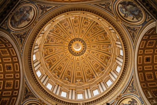 Free From below of magnificent ornamental dome of Papal Basilica of Saint Peter in Vatican Stock Photo