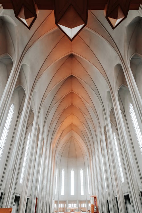 Old cathedral interior with arched vaults and windows