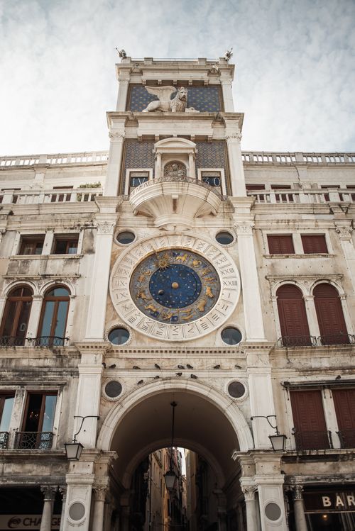 Free From below exterior of beautiful old medieval St. Marks Clocktower located on St. Marks square in Venice Stock Photo