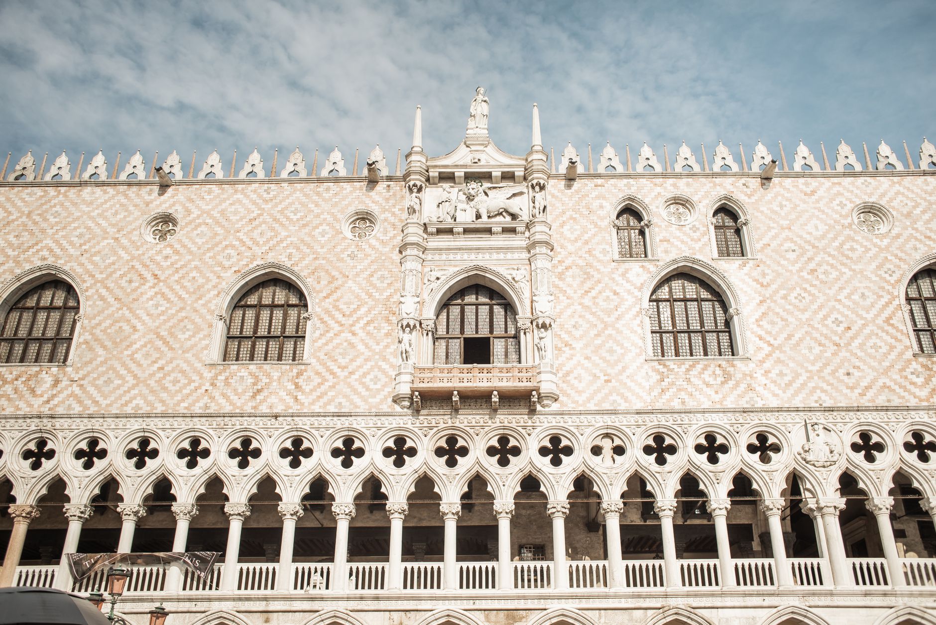 Doge's Palace Venice — ornamental Gothic facade with white pillars