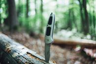 A Silver Hunting Jack Knife on the Wood