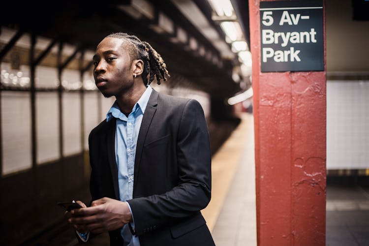 Serious Young Male Waiting For Train In New York Underground