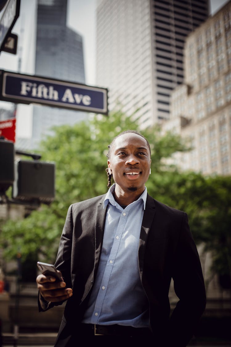 Positive Businessman Listening To Music On New York Street