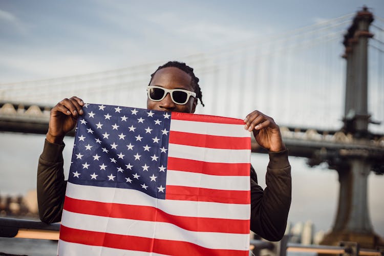 Friendly Man With US Flag Kerchief In Hands