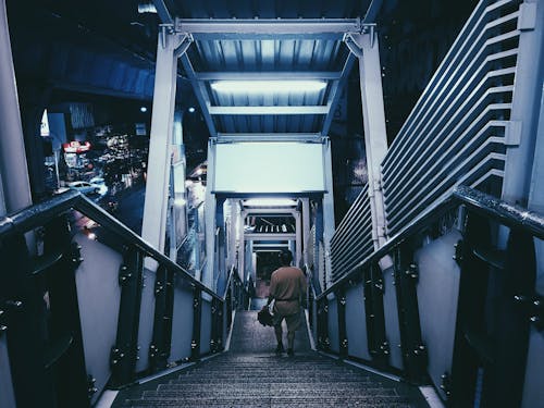 Man Walking Down a Stairs