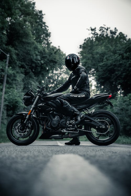 A Man in Black Leather Riding Suit 