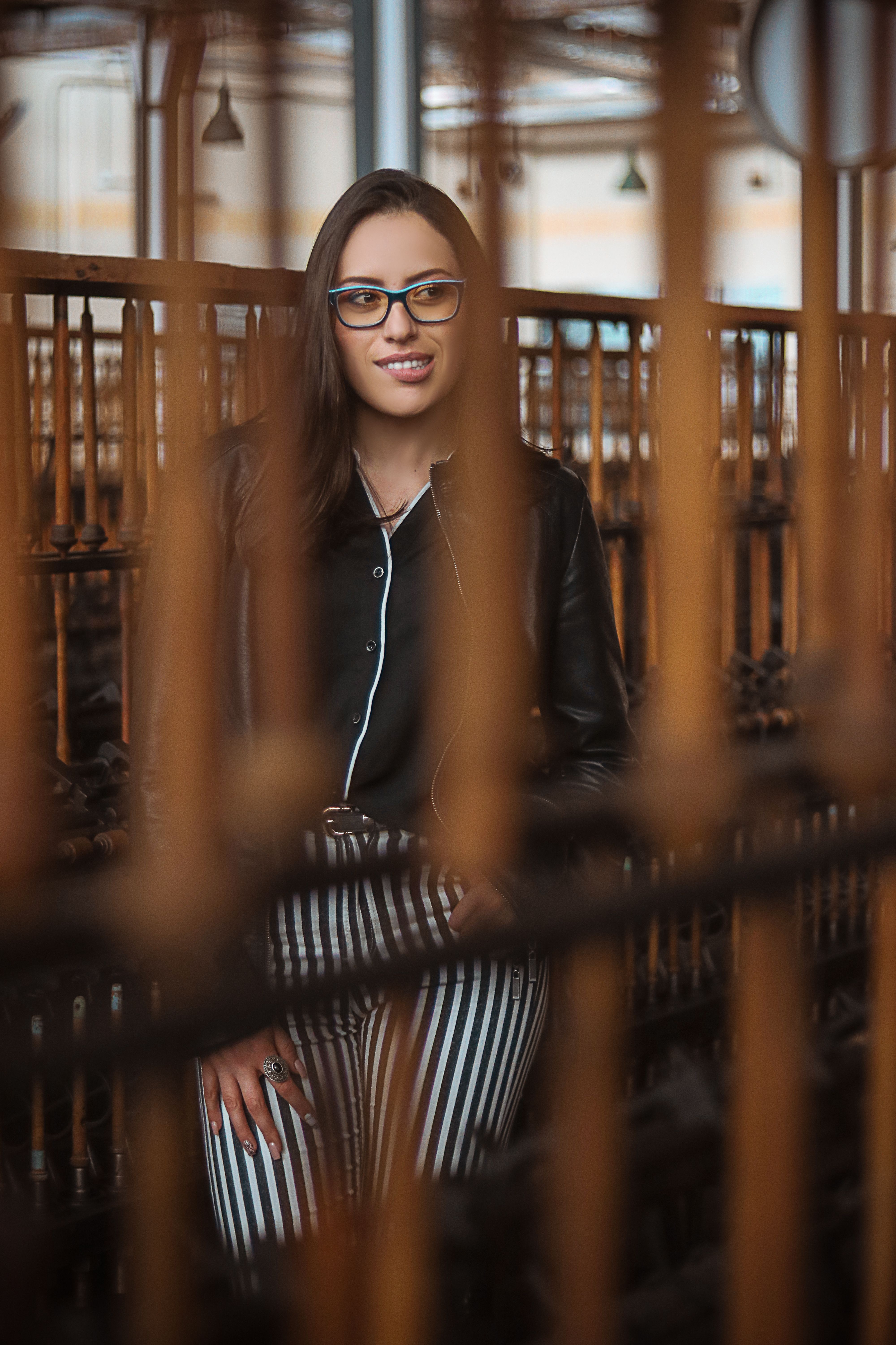 A Woman in Black Leather Jacket Wearing Eyeglasses · Free Stock Photo