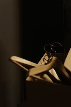 A detailed shot of wooden hangers inside a cardboard box, ideal for relocation or storage themes.