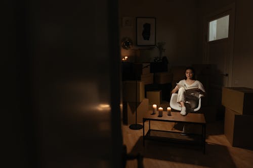 Man in White Dress Shirt Sitting on Chair