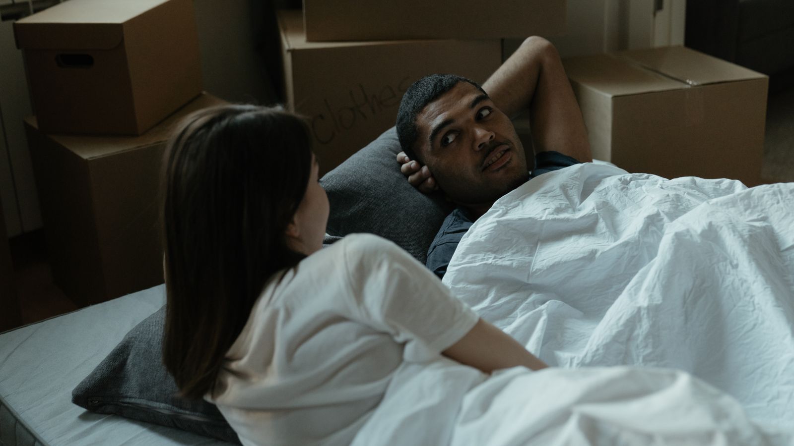 A couple relaxing in a warm bedroom