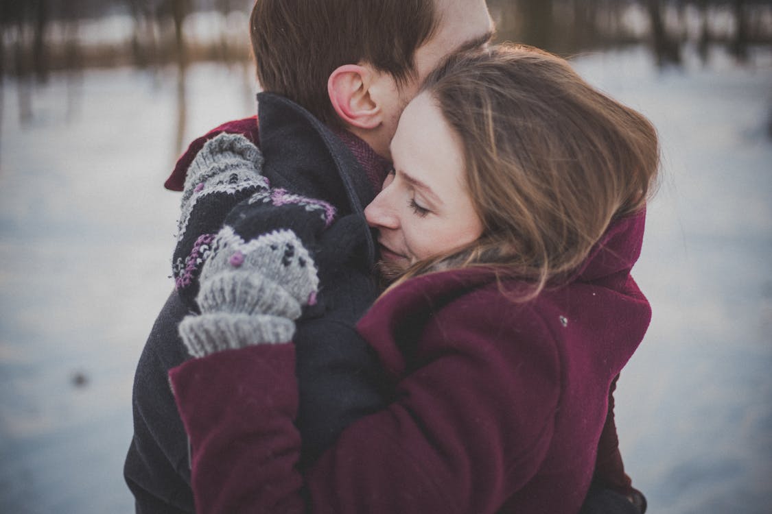 Free Man Hugging a Woman Outdoor Stock Photo