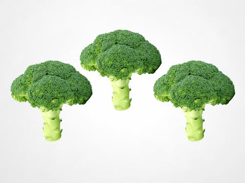 Green Broccoli on White Surface