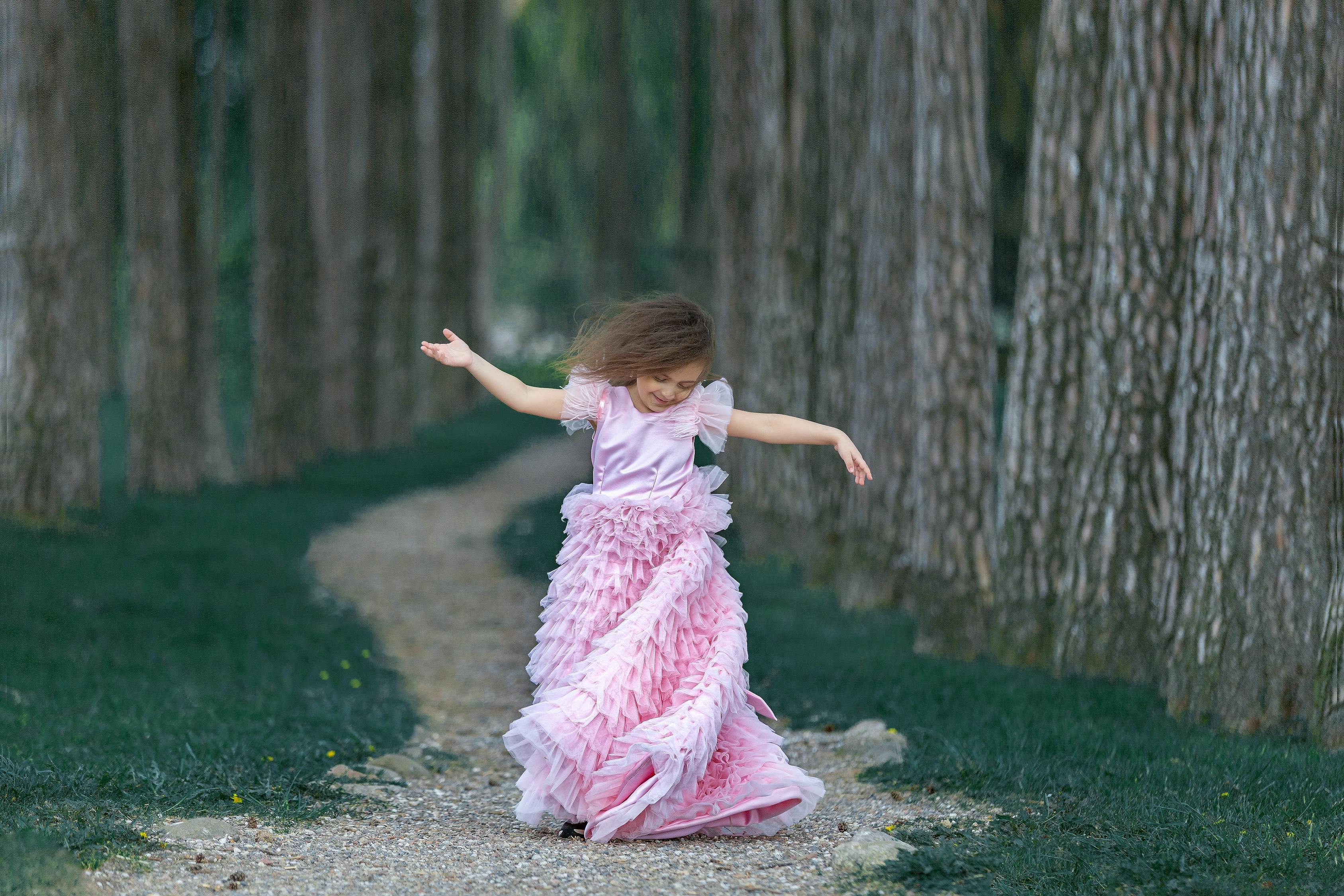 Little girl dancing in forest · Free Stock Photo