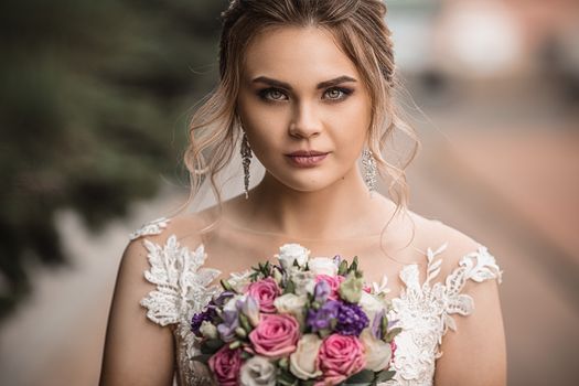 Beautiful bride with wedding bouquet