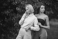 Casual female models standing near tree