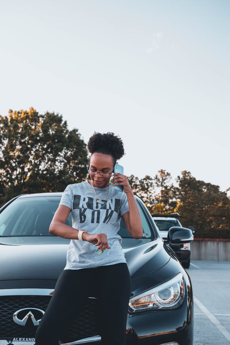 Black Woman Standing Near Black Car