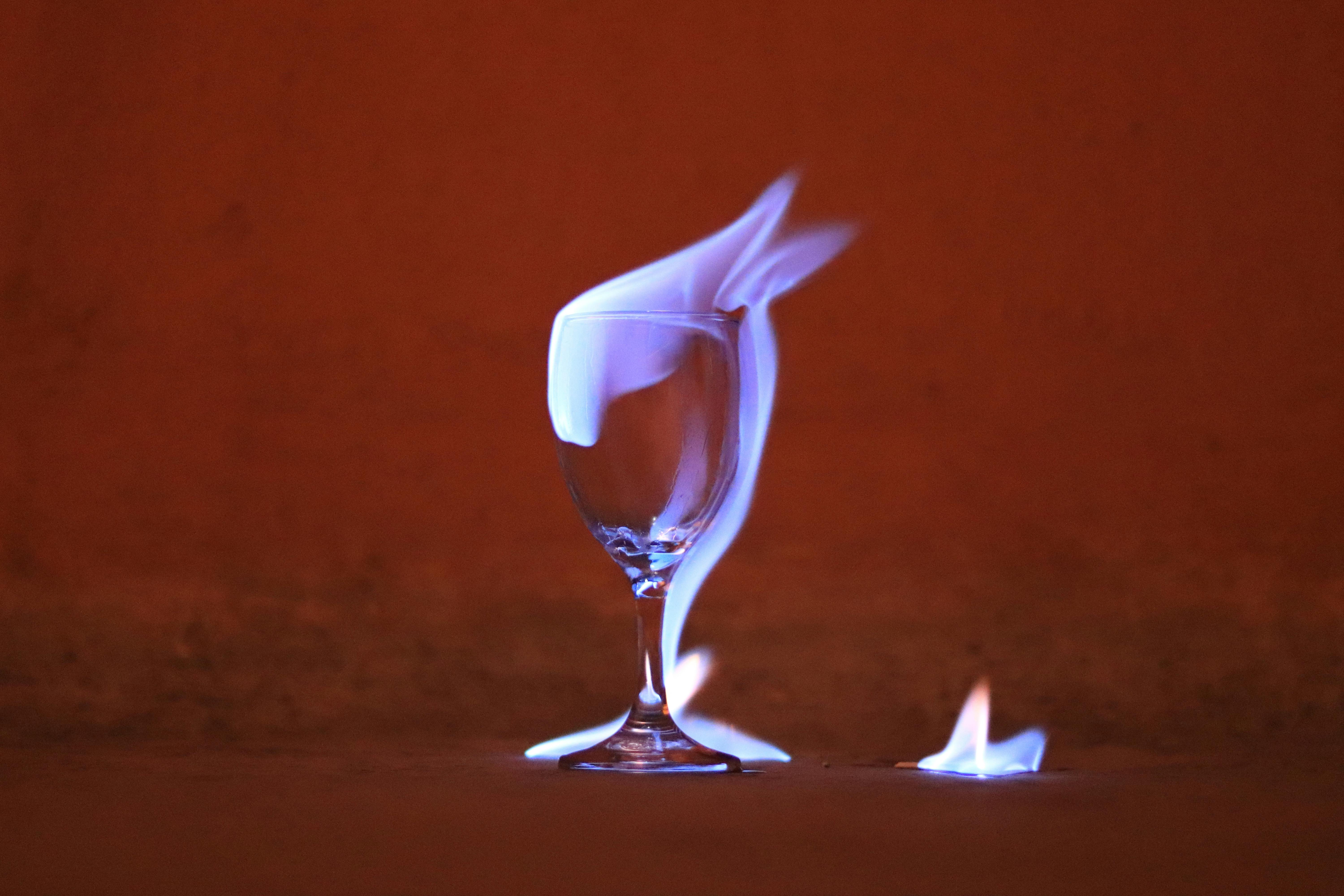 clear wine glass on red background