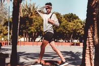 Skinny gay male walking in sunlight