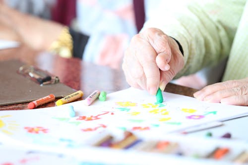 Free Crop elderly patient with crayons Stock Photo