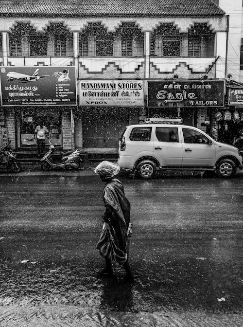 Photo of a Person Walking in a Heavy Rain