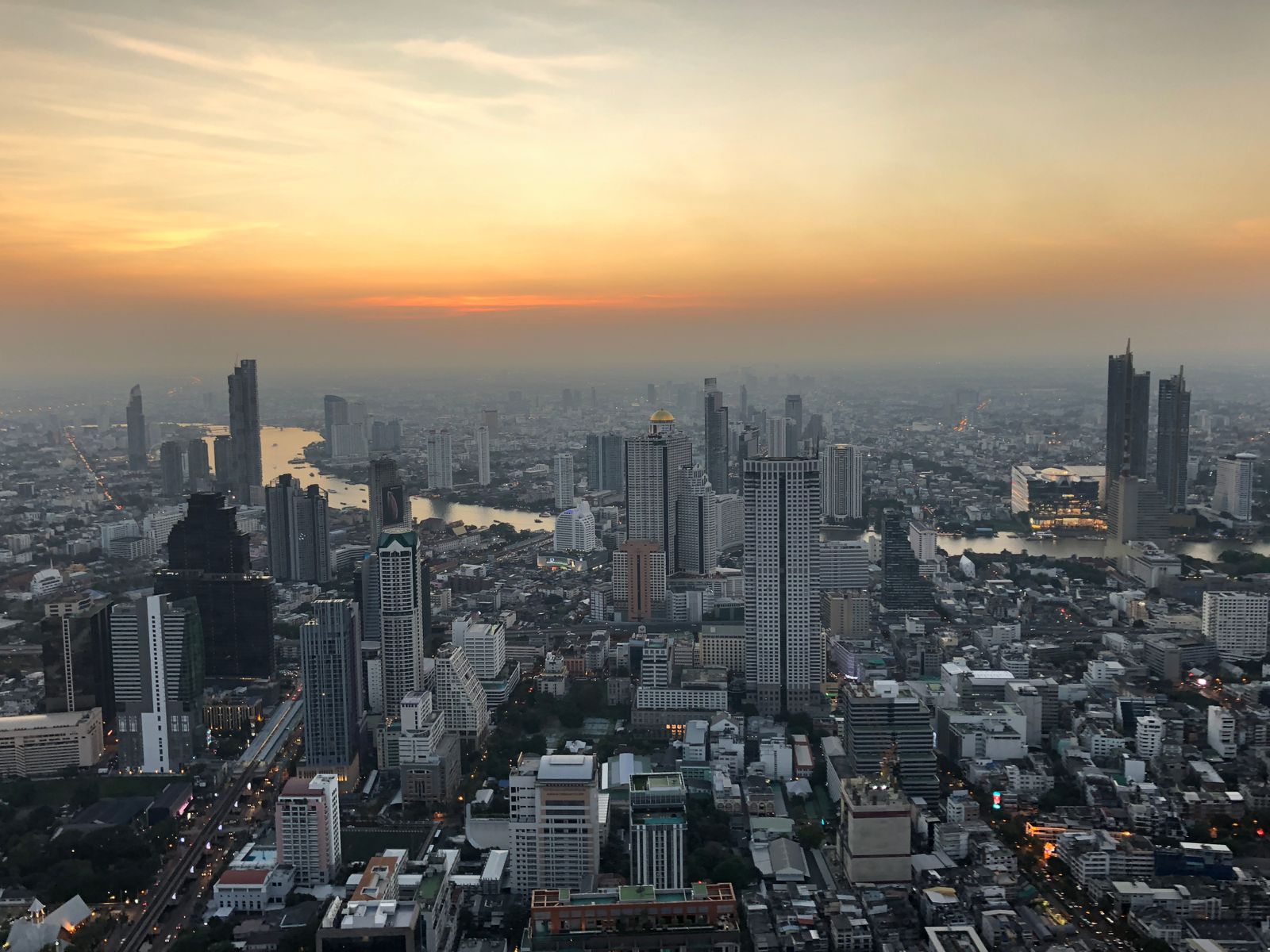 Bangkok skyline aerial view at sunset with Chao Phraya river