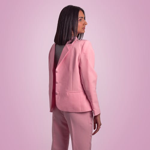 Stylish woman in pink suit