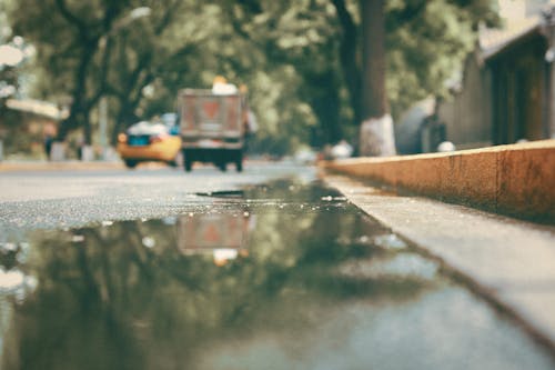 Free A Puddle on the Road Stock Photo