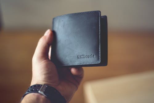 Person Holding Black Leather Bifold Wallet