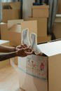 Person Holding Brown Cardboard Box