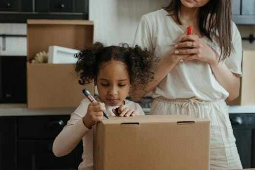 A mother and her daughter pack boxes while moving into their new home, embracing family life.