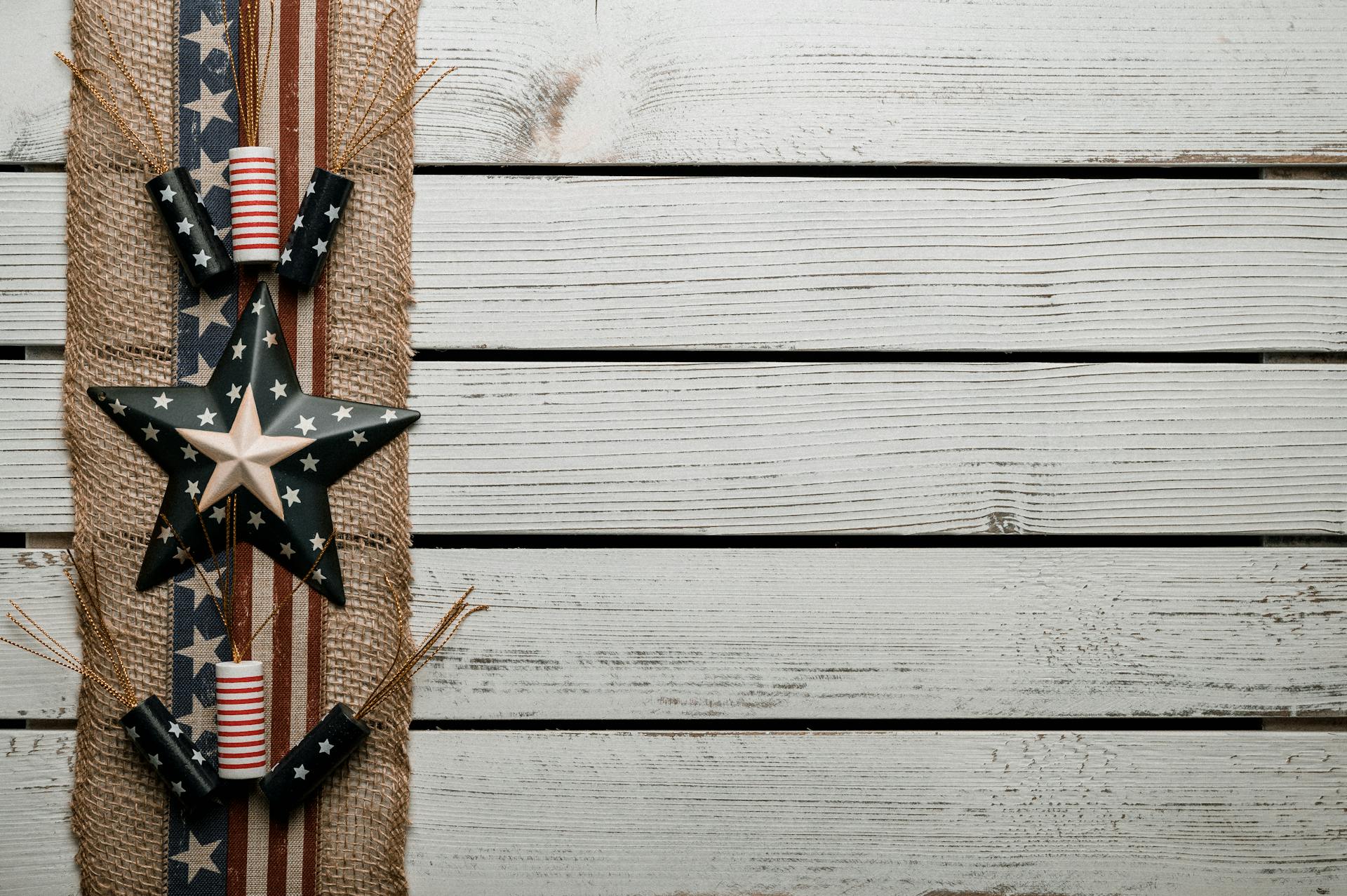 Wooden table decorated with badges and tape with United States flag