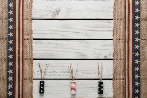 Various decorations with US flag patterns on white wooden table