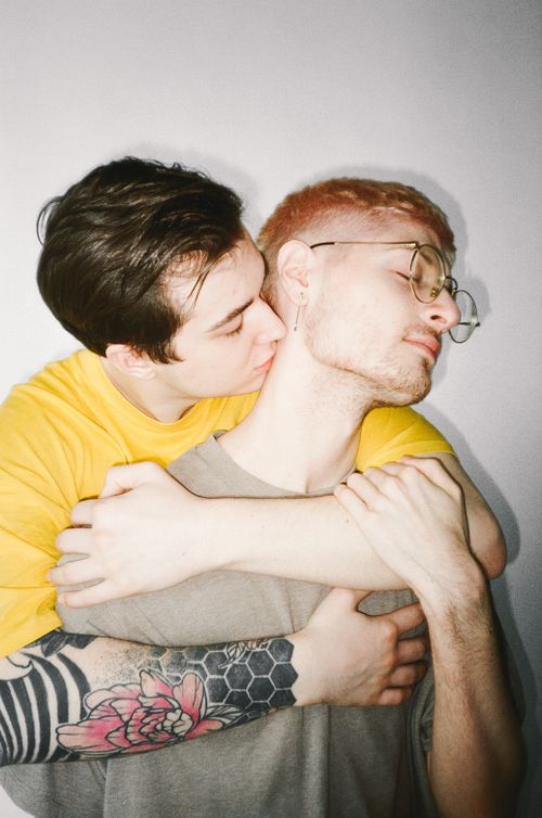 Free A heartfelt moment capturing love and tenderness between two young men embracing. Stock Photo