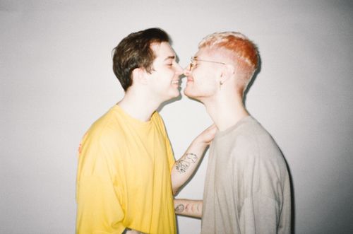 Free A loving couple shares a tender moment indoors, showcasing affection and pride. Stock Photo