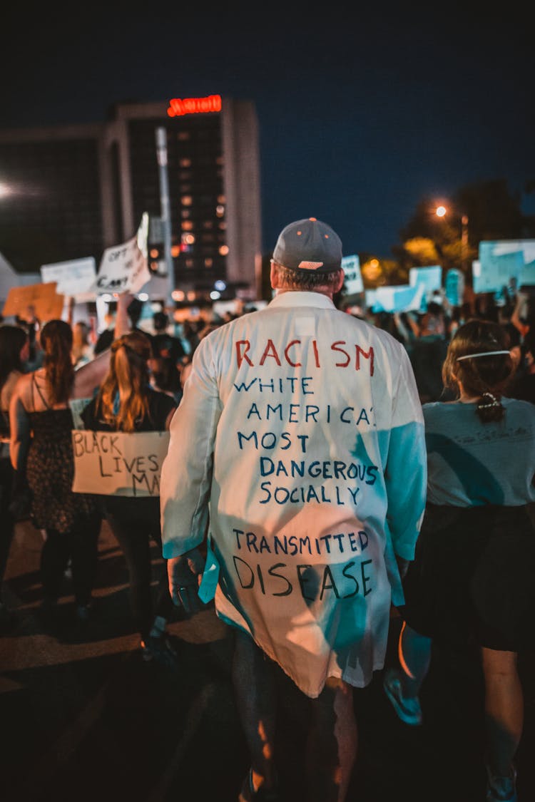 Unrecognizable People Protesting On Street At Night During BLM Movement