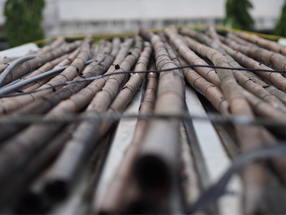 Stack of cut bamboo logs in countryside