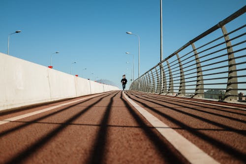 People Walking on Gray Concrete Road