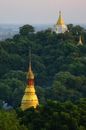 Old historical Buddhist temples on green hill