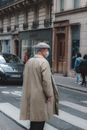 Unrecognizable man crossing road in big city