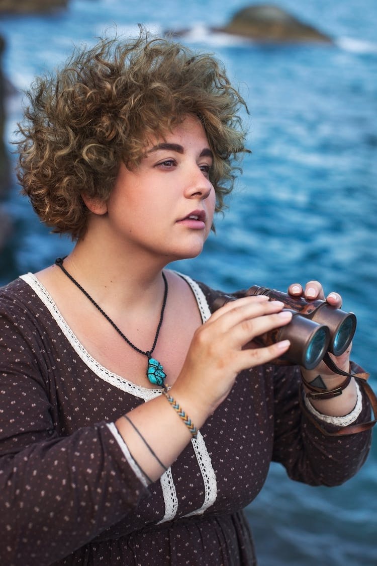 Portrait Of A Woman Holding Binoculars