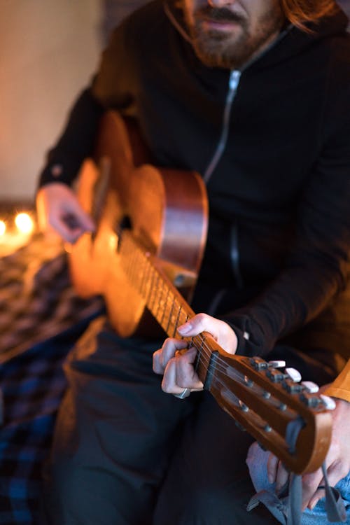 Close-up of a Man Playing Guitar