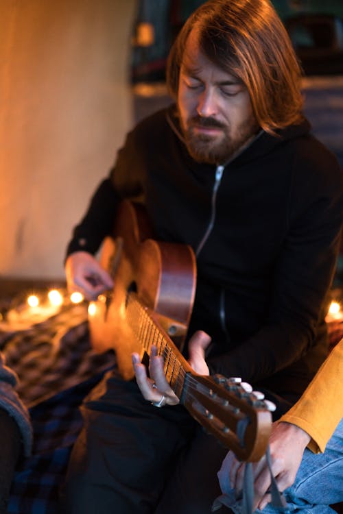 Man Playing the Guitar