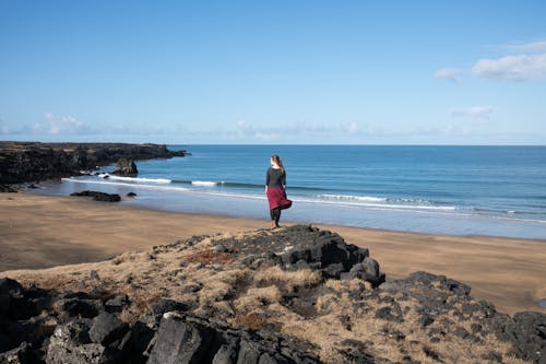 Woman on Beach Looking at View