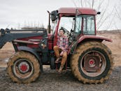 Man Sitting in Tractor