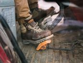 Person Wearing Brown Leather Work Boots