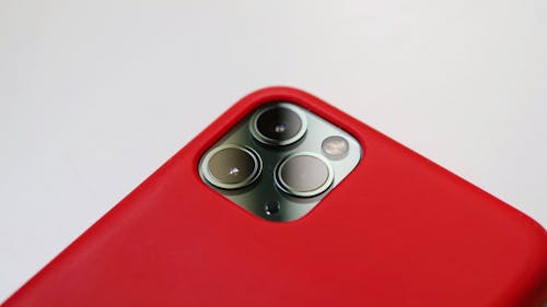 Camera of an Iphone with Red Case in Close-up Photography