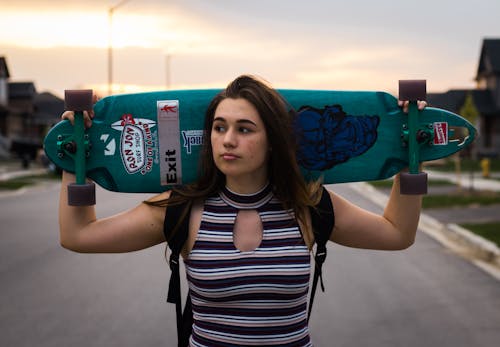 Woman Holding Wheel Cut-out Longboard