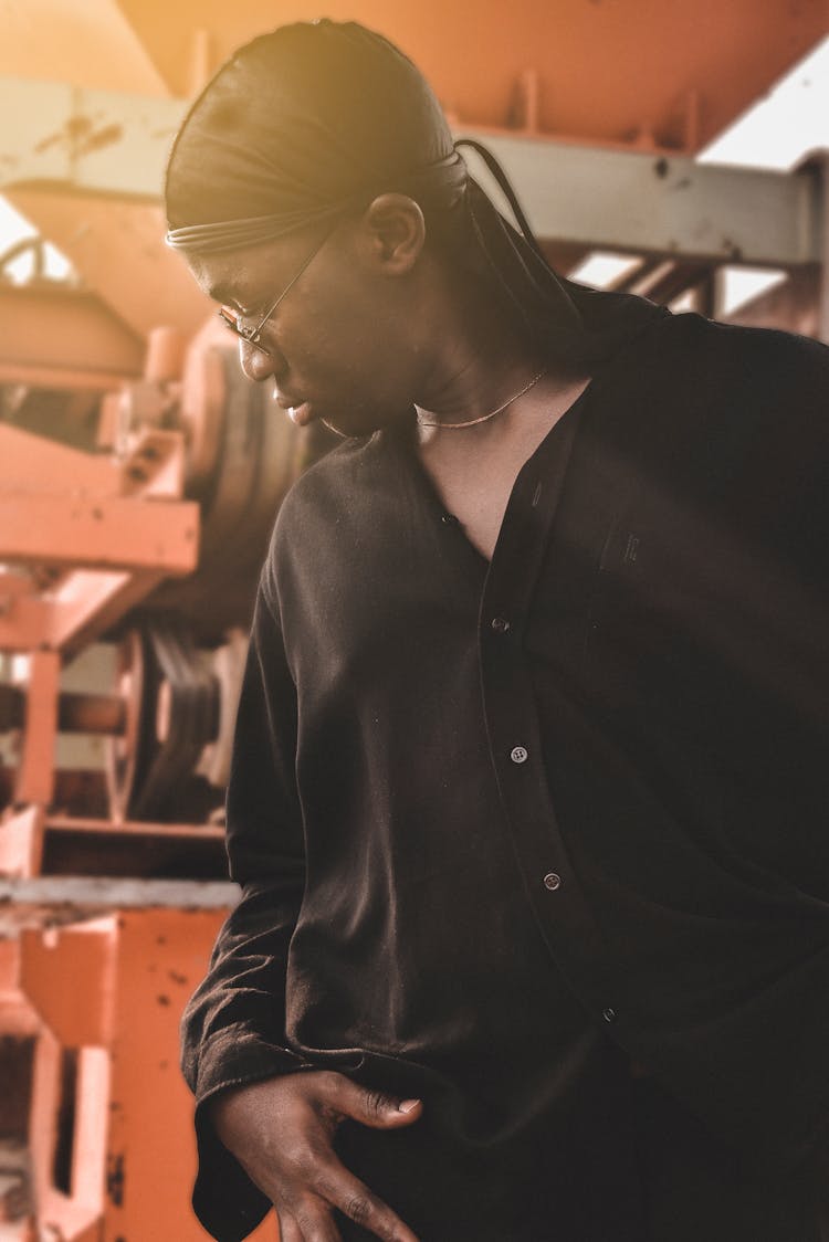 Serious Black Guy Standing Near Industrial Factory